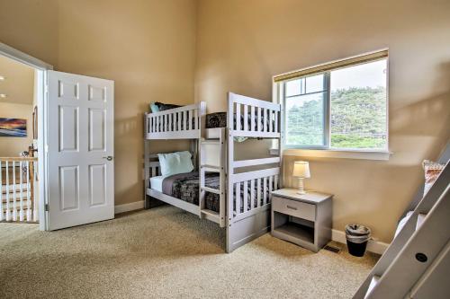 a bedroom with two bunk beds and a window at Oceanfront South Beach Home with Hot Tub and Sauna in Newport