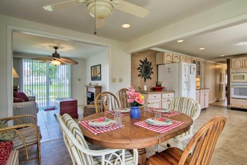 a kitchen and dining room with a wooden table and chairs at Charming Painter Home with Chesapeake Bay Views in Exmore