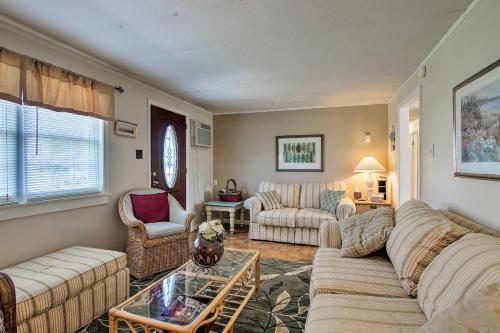 a living room with a couch and a table at Charming Painter Home with Chesapeake Bay Views in Exmore