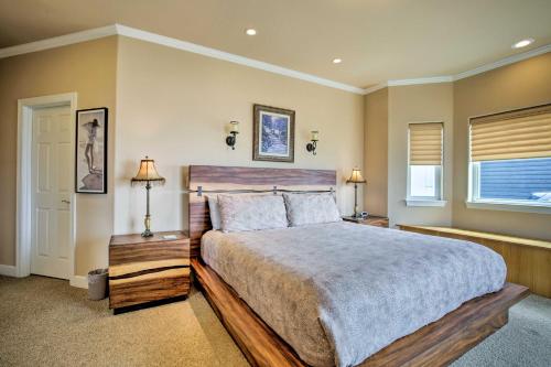 a bedroom with a large bed and a window at Oceanfront South Beach Home with Hot Tub and Sauna in Newport