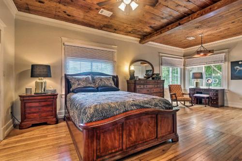 a bedroom with a bed and a desk in a room at Spacious and Updated 1920s HSNP Craftsmen Home in Hot Springs