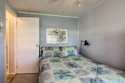 a bedroom with a bed with a quilt on it at Charming Painter Home with Chesapeake Bay Views in Exmore