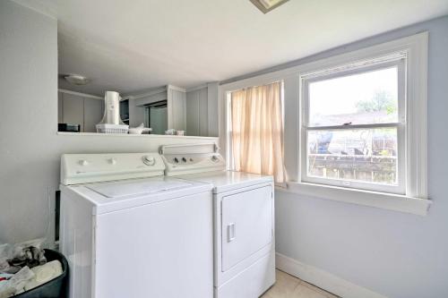 a kitchen with a washing machine and a window at Historic Oklahoma City Home, 5 Mi to Downtown in Oklahoma City