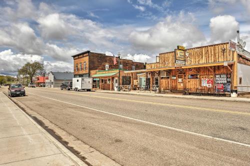 an empty road in an old western town with buildings at Spacious Home 10 Minutes to Ten Sleep Canyon! in Ten Sleep