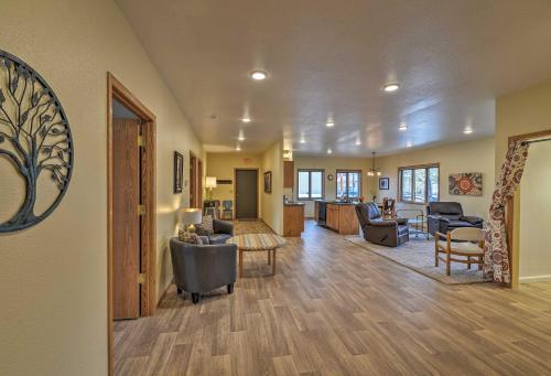 a living room with a couch and a table at Spacious Home 10 Minutes to Ten Sleep Canyon! in Ten Sleep