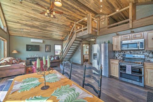 a kitchen and living room with a wooden ceiling at Mtn-View Cabin 40 Mi to Yellowstone Ntl Park! in Livingston