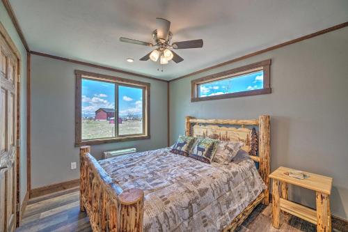 a bedroom with a bed and a ceiling fan at Mtn-View Cabin 40 Mi to Yellowstone Ntl Park! in Livingston