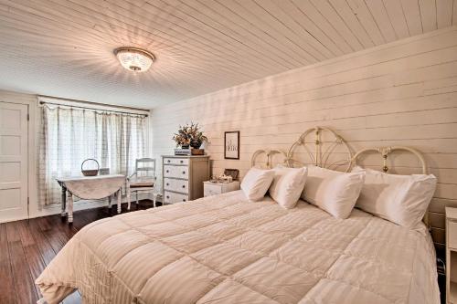 a bedroom with a large bed and a table at Estes Park Home about 8 Mi to Rocky Mtn Natl Park! in Drake