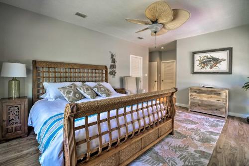 a bedroom with a bed and a ceiling fan at Relaxing Riverfront Oasis 5 Mi to Satellite Beach in Merritt Island