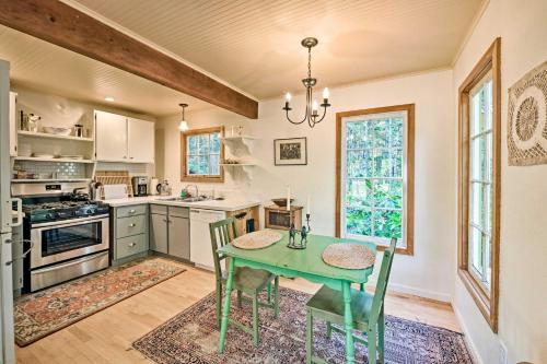 a kitchen with a green table and chairs in it at Port Townsend Cottage Near Wineries and Golf in Port Townsend