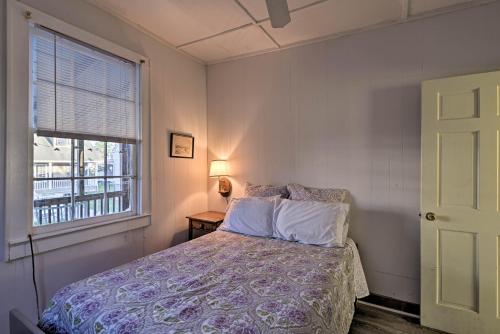 a bedroom with a bed and a window at Pawleys Island House, - Steps to Beach and Creek! in Pawleys Island