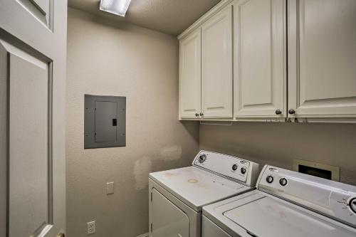 a white laundry room with a washer and dryer at Spacious Downtown Chico Home about Half Mile to CSU! in Chico