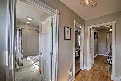 a hallway with a door leading to a room at Updated Indianapolis Home, Walk to Lucas Oil! in Indianapolis