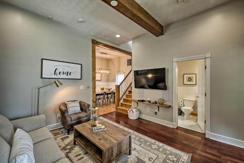 a living room with a couch and a tv at Updated Indianapolis Home, Walk to Lucas Oil! in Indianapolis