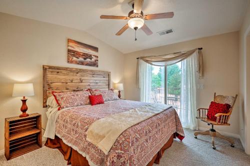 a bedroom with a bed and a ceiling fan at Kanab Condo with Pool and Patio, 30 Mi to Zion NP in Kanab