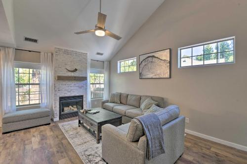 
a living room filled with furniture and a window at Modern Flagstaff Home with BBQ, Walk Downtown! in Flagstaff
