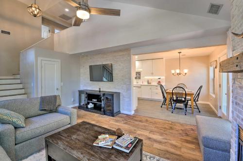 a living room with a couch and a table at Modern Flagstaff Home with BBQ Walk Downtown! in Flagstaff