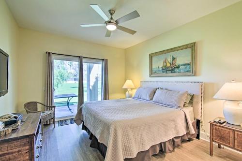 a bedroom with a bed and a ceiling fan at Cathedral City Condo on Golf Course with Patio! in Cathedral City