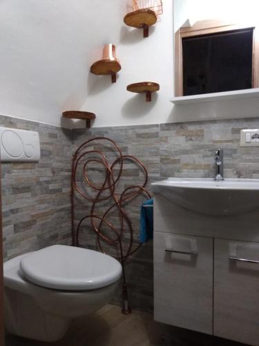 a bathroom with a toilet and a sink at C'era Una Volta... in Altamura