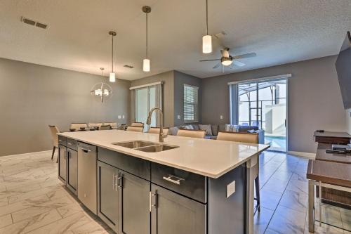 a kitchen with a sink and a counter top at Kissimmee Retreat with Pool, about 6 Mi to Disney in Kissimmee