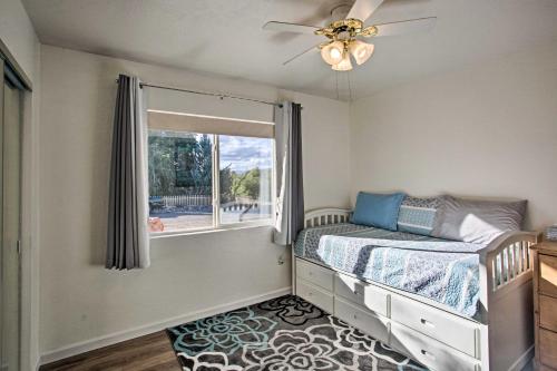 a bedroom with a bed and a window at S Cottonwood Home with Yard, 3 Mi to Main St in Cottonwood