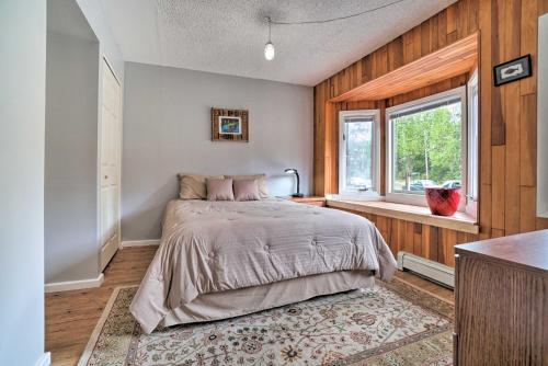 a bedroom with a bed and a window at Convenient Kenai Apt - 3 Mi to Beach and Fishing in Kenai