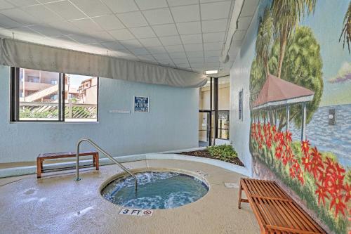 a hot tub in a room with a painting on the wall at Community Pool Access Condo in Myrtle Beach in Myrtle Beach