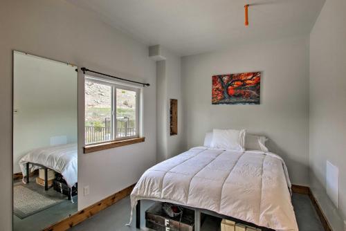 a bedroom with a bed and a window at Modern Lava Hot Springs Studio, Walk to Pools in Lava Hot Springs