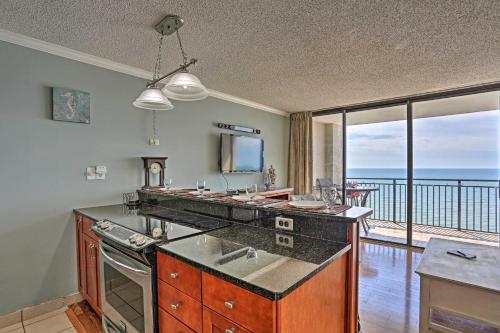 a kitchen with a stove and a view of the ocean at Community Pool Access Condo in Myrtle Beach in Myrtle Beach