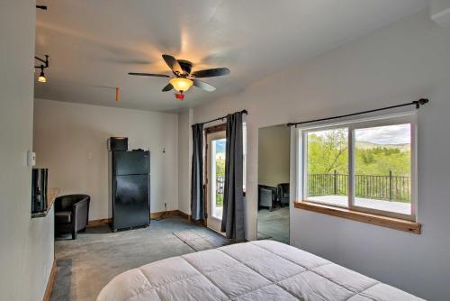 a bedroom with a bed and a ceiling fan at Modern Lava Hot Springs Studio, Walk to Pools in Lava Hot Springs