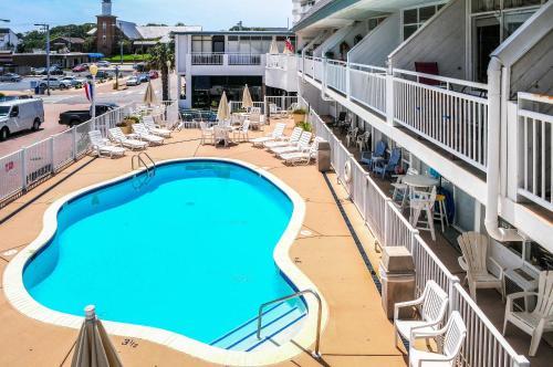 a swimming pool on the balcony of a hotel at Oceanfront Resort Studio on Virginia Beach! in Virginia Beach