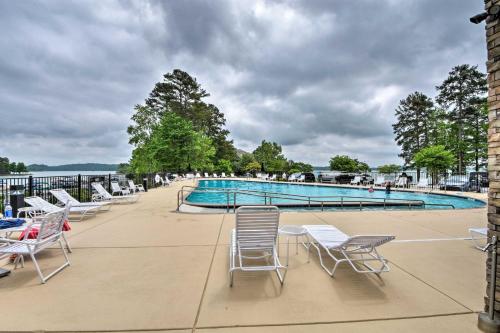 a group of chairs and a swimming pool at Condo on Lake Keowee with Resort Amenities and Pool! in Salem