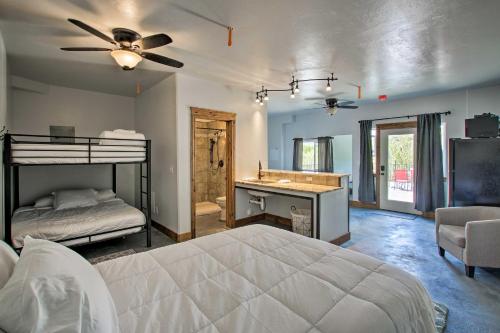 a bedroom with two bunk beds and a bathroom at Lava Hot Springs Studio 4-Min Walk to Pools! in Lava Hot Springs