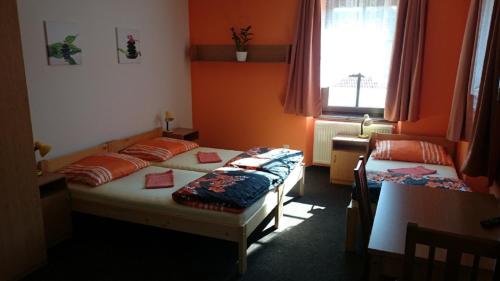 Postel nebo postele na pokoji v ubytování Penzion a restaurace U Pošů
