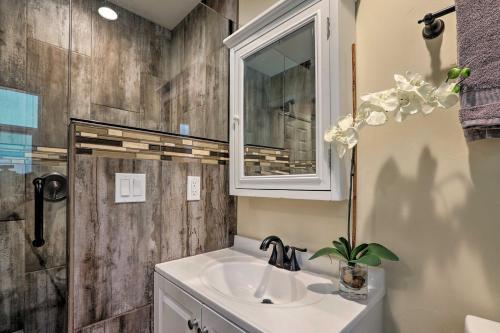 a bathroom with a sink and a mirror and a shower at 1 Mi to Skiing and Beaches Incline Village Home! in Incline Village