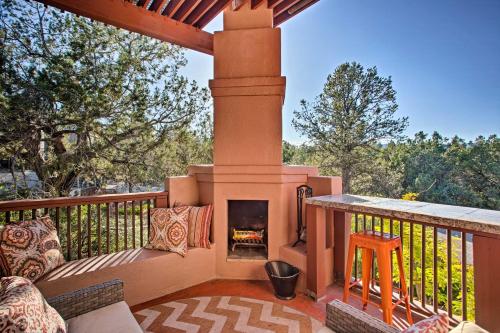 a patio with a fireplace on a deck at Furnished Patio and Views West Sedona House! in Sedona