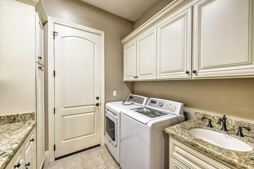 a kitchen with a washing machine and a sink at Near Wineries Elk Grove Getaway with Saltwater Pool in Elk Grove