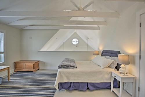 a bedroom with a large bed and a ceiling at Money Island Home with Deck, Kayak and Paddleboards! in Branford