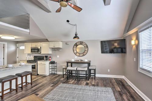 a kitchen and living room with a ceiling fan at Updated Lake Erie Home about 34 Mi to Cedar Point! in Lorain