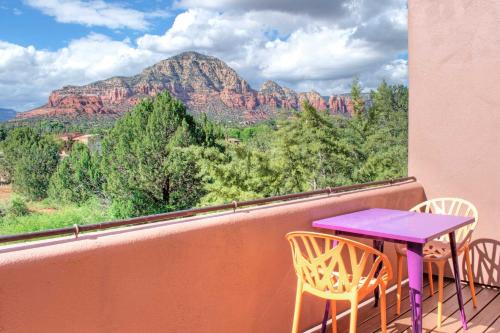 a purple table and chairs on a balcony with a view at Furnished Patio and Views West Sedona House! in Sedona