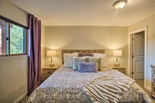 a bedroom with a large bed with two lamps at Furnished Patio and Views West Sedona House! in Sedona