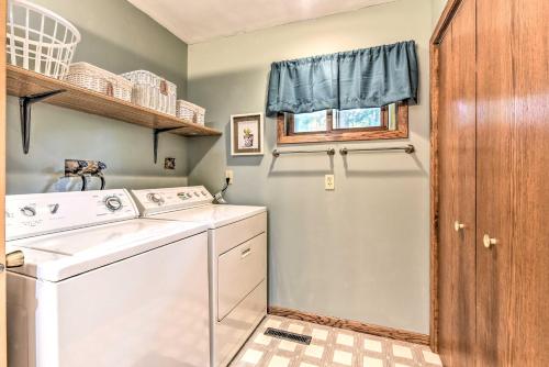 a laundry room with a washer and dryer at Fishermens Paradise with Fire Pit on Rice Lake! in Rice Lake