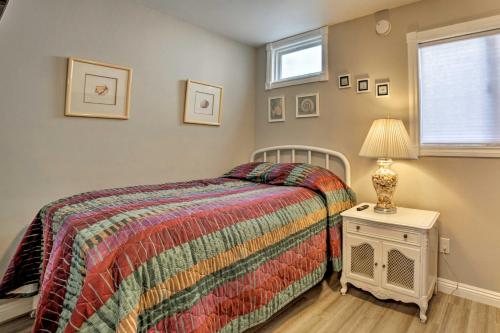 a bedroom with a bed and a lamp on a night stand at Updated Home on Catalina Island Walk to the Coast in Avalon