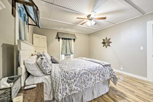 a bedroom with a bed and a ceiling fan at Day Trip to Waco and Temple House on Cattle Farm in Lorena