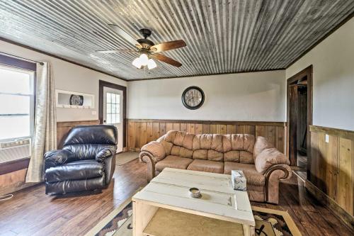 a living room with a couch and a ceiling fan at Day Trip to Waco and Temple House on Cattle Farm in Lorena