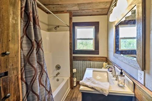 a bathroom with a sink and a tub at Day Trip to Waco and Temple House on Cattle Farm in Lorena