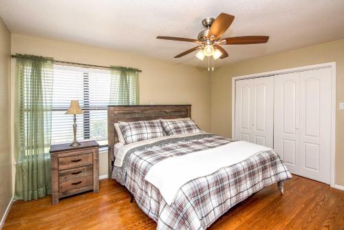 a bedroom with a bed and a ceiling fan at Del Rio Home with Lake Access and Boat Storage! in Del Rio