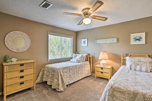 a bedroom with two beds and a ceiling fan at Destin Townhome with Beach Access & 2 Pools! in Destin