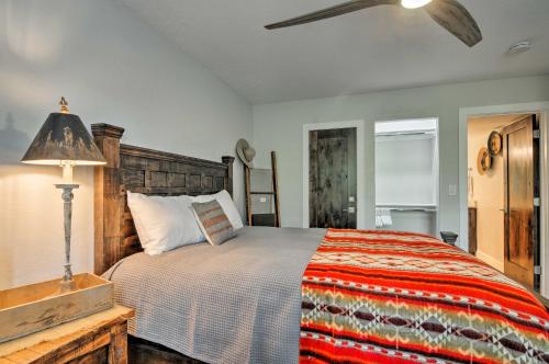 a bedroom with a bed and a ceiling fan at Rustic Ski-Out Brian Head Condo with Comm Pool in Brian Head