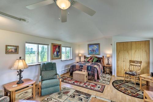 a living room with a bed and a couch at Columbia Falls Home 19 Mi to Glacier National Park in Columbia Falls